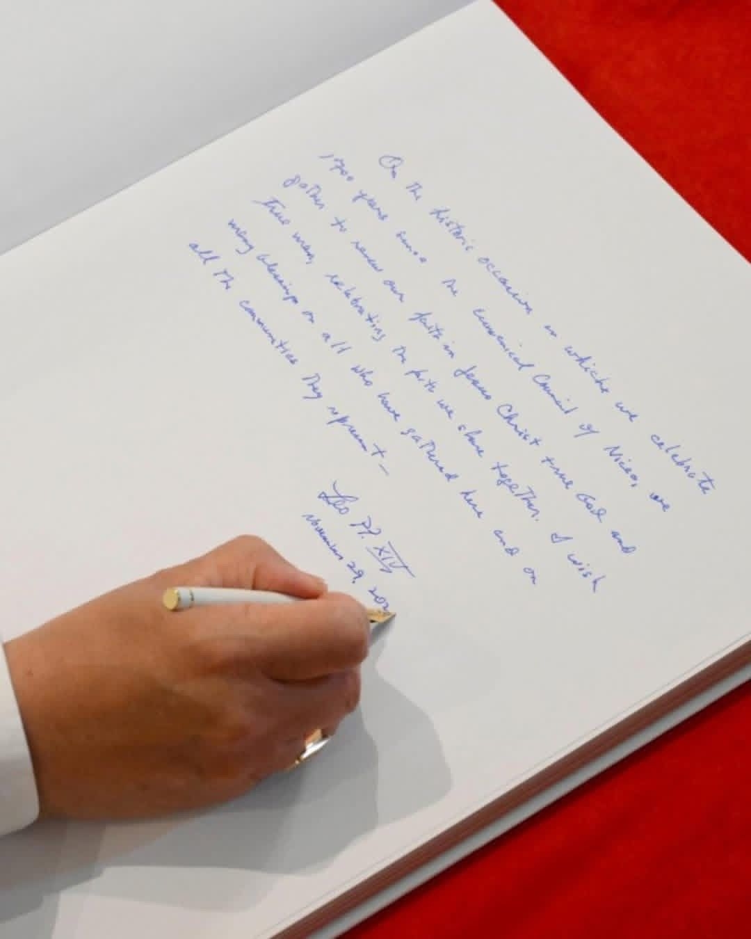 Pope Leo XIV Leaves His Mark in the Book of Honor at St. Ephrem Syriac Orthodox Church in Istanbul.